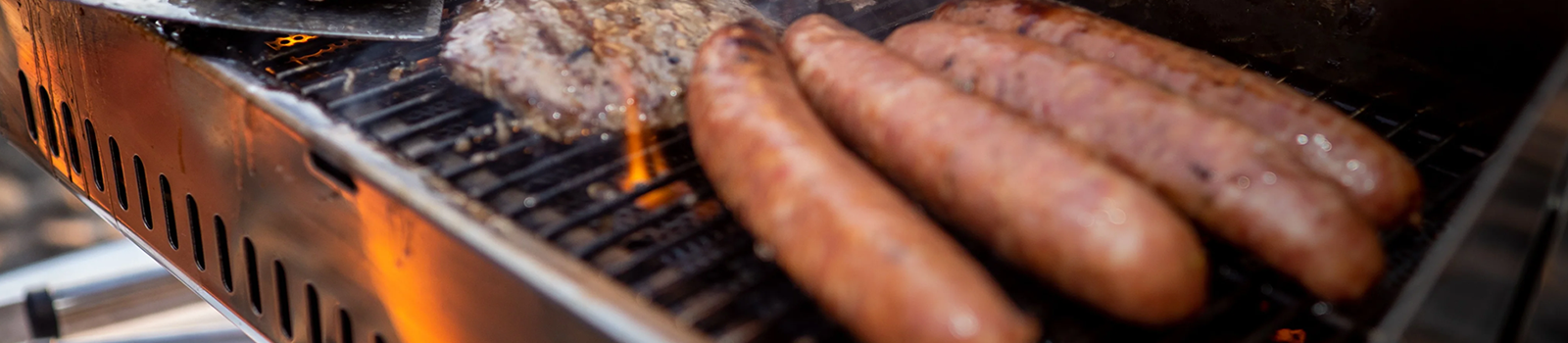 hot dogs and hamburgers on the Magma grill