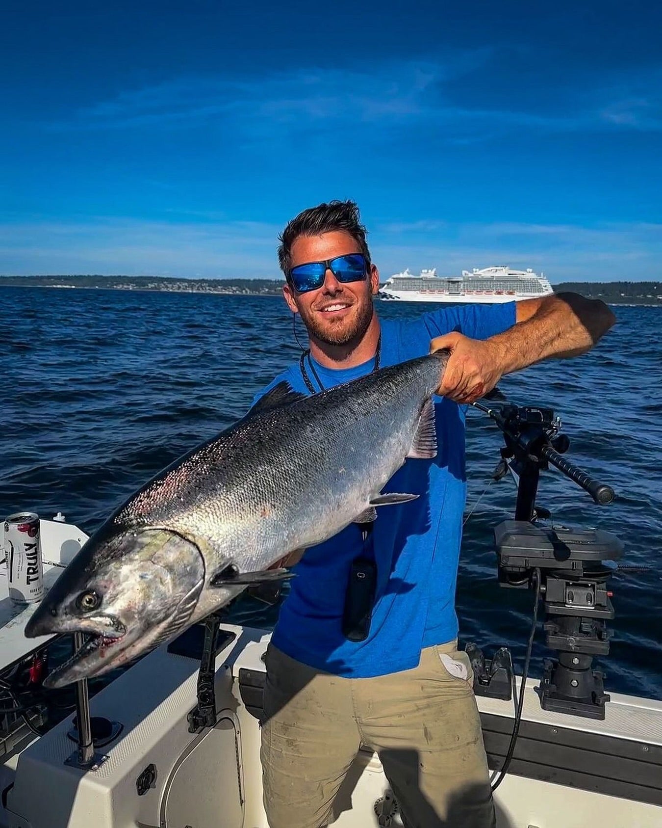 A Person from Magma Company is Holding a Fish.