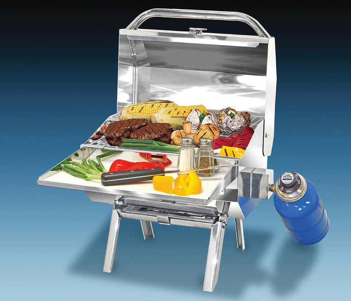 Trailmate Rectangular grill with grilled steak and vegetables on table legs
