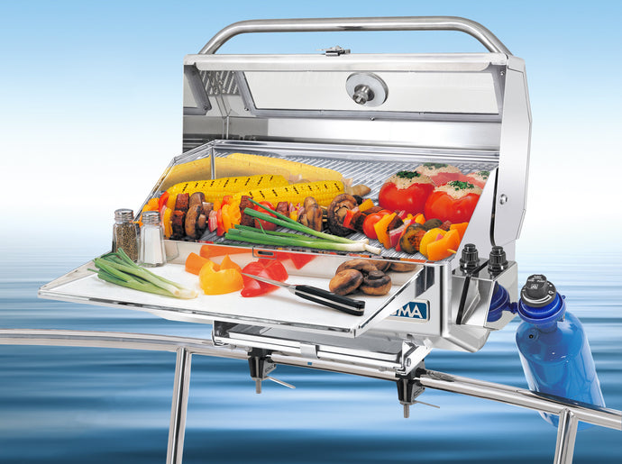 Newport Infrared Rectangular grill mounted on boat with grilled skewers and vegetables